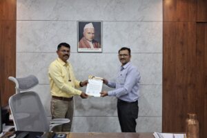 Principal Sir presenting appreciation letter to Professor Deepak Mahajan